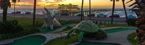 Discover the hidden treasures of Galveston's historic Strand District on a magical carpet putt putt adventure